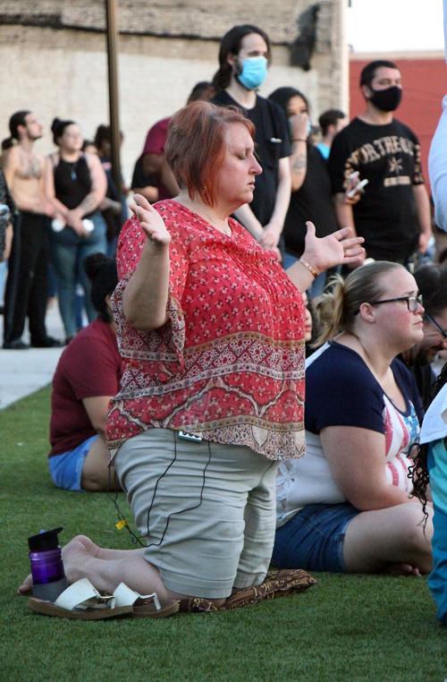 06-05 vigil praying woman.jpg