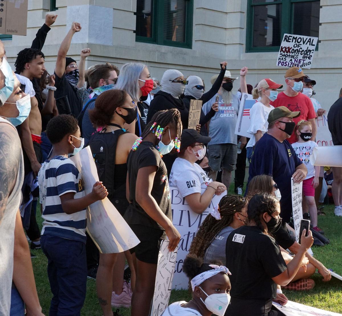 8-4 protest raised fists.jpg