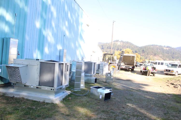 Crews with TRM Services work to install the HVAC system at the Cormana Building. The group was successfully able to install the ducts inside of the building and are now connecting the ventilaiton ducts to the outside HVAC units.