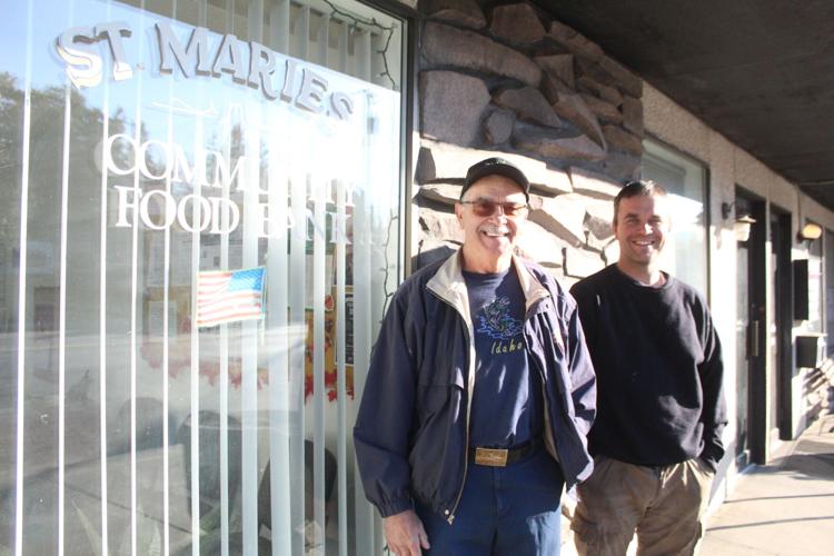 The St. Maries Church of Jesus Christ of lateer-day Saints is teaming up with the St. Mary's Immaculate Catholic Church to help gather items for the local food bank. Pictured is Catholic church member Ed Spooner and his son, Jesus Christ of latter-day S...
