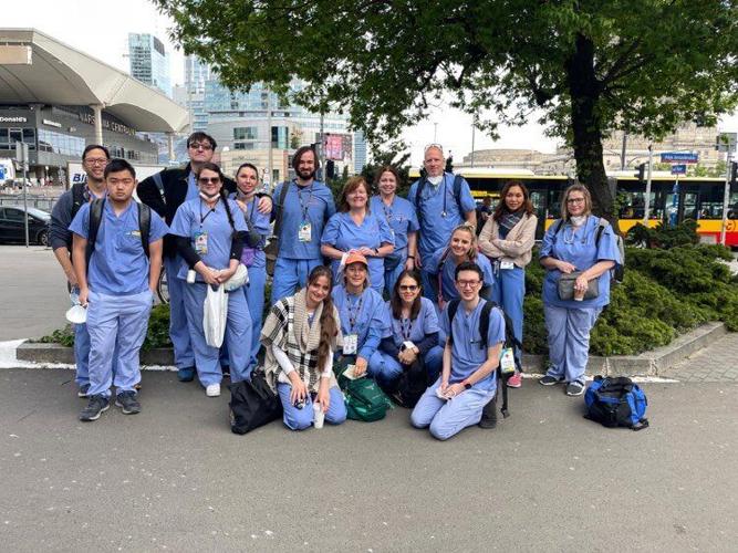 Volunteers from across the U.S. including local nurse Margie Cooke (center right) pose for a group photo in Warsaw Poland.