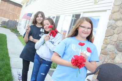 The American Legion Auxiliary recently recvived its junior program. They will be assisting with poppy distribution this year as well as other American Legion porjects. Pictured: Karlie Morris, Davy Roedel and Christie Sotin.