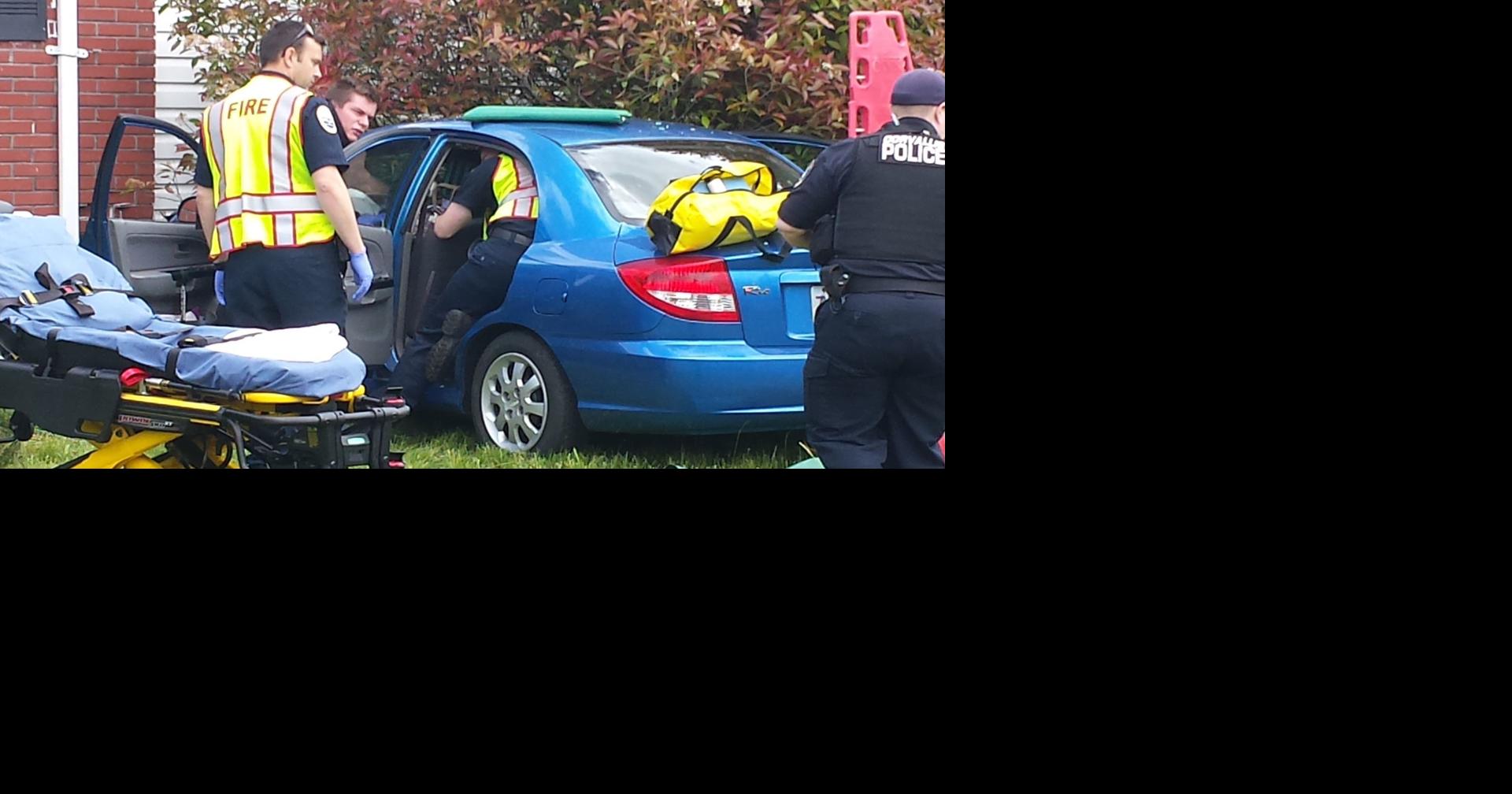 Police: Driver who ran into house was using phone