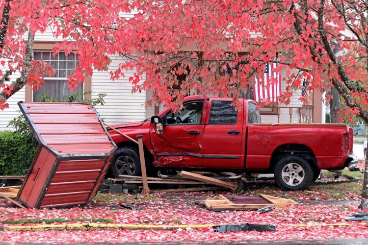 Albany crash leaves truck on porch