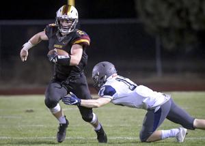 Prep football: Knight does it all for Raiders