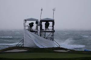 Rain, raging wind shove Pebble Beach final round to Monday