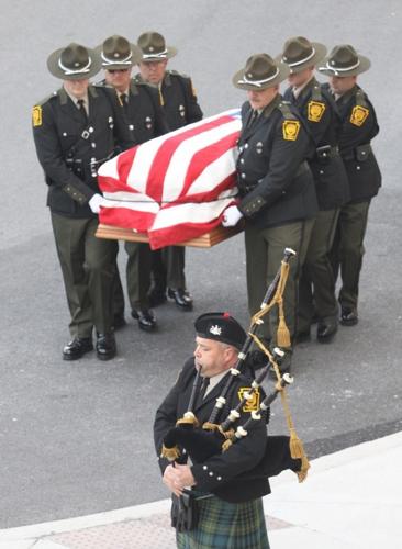 Thousands attend game warden's funeral