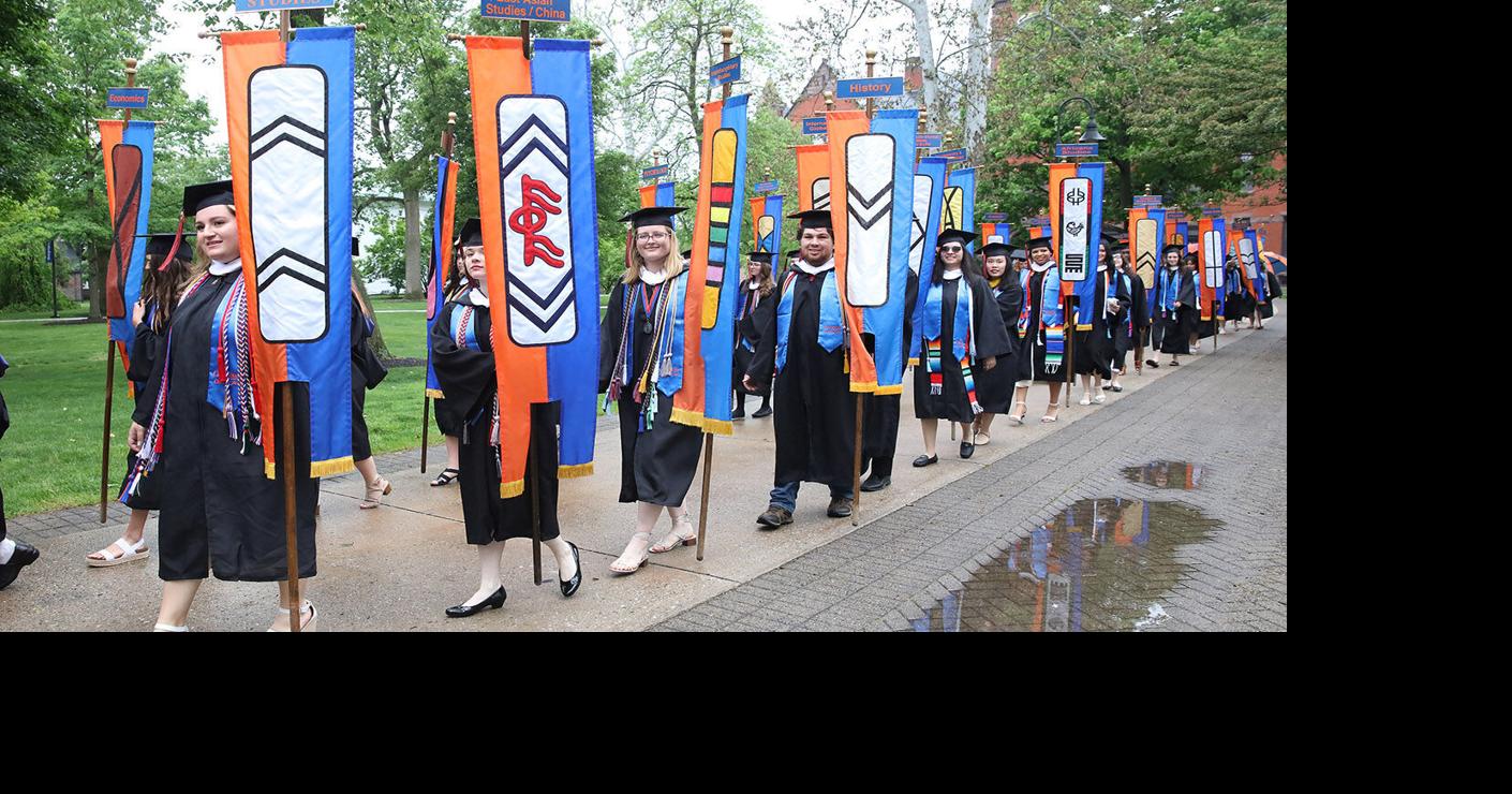 Banner carriers at college graduation Local News