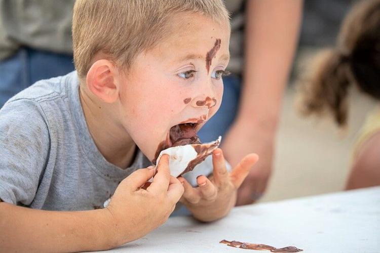 This young boy's face got a little bit sticky eating at the 2023 Hancock County District Fair..jpg