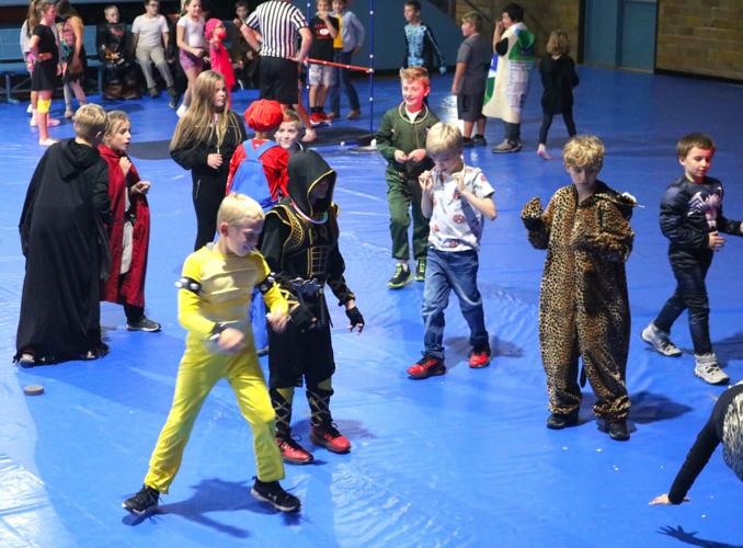 Costumed elementary school kids get their groove on to the music. Behind them, Brett Geelan mans a limbo contest in the Civic Audiorium..JPG