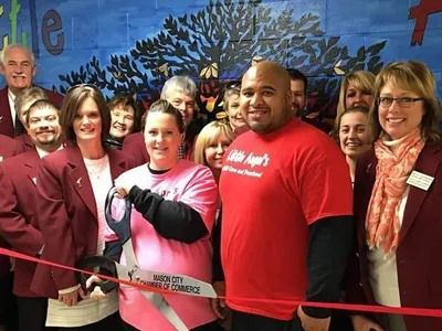 Katie and Carl Mason City Ribbon Cutting.jpg