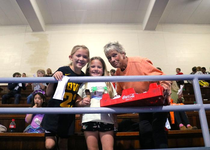Elyse Zrostlik, dressed as Iowa Hawkeye Caitlin Clark, and Jordy Johnson were all smiles when Parks and Rec Director Sue Edmondson came with Drumstick chocolate covered ice cream cones to cap a pizza feast..JPG