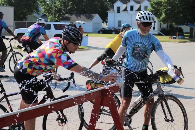 RAGBRAI riders reach for a drink.JPG