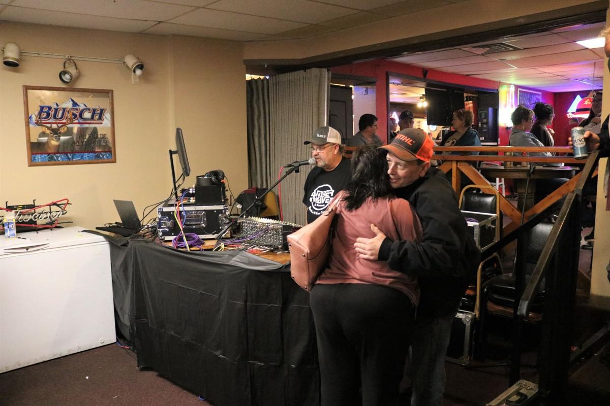 Mark Gjerde of Britt hugs a guest at the Tammy Lenox benefit and concert on Nov. 22 in Garner..JPG