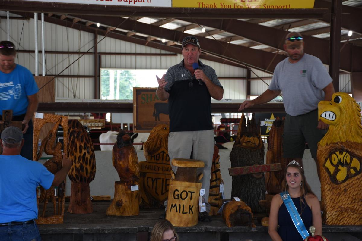 woodcarving auction at the mitchell county fair with