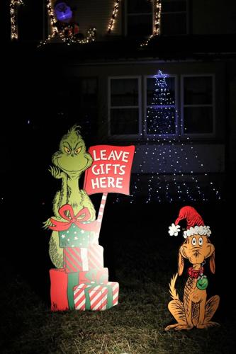 The Grinch and his pooch are grabbing gifts in front of the 1940s house..JPG