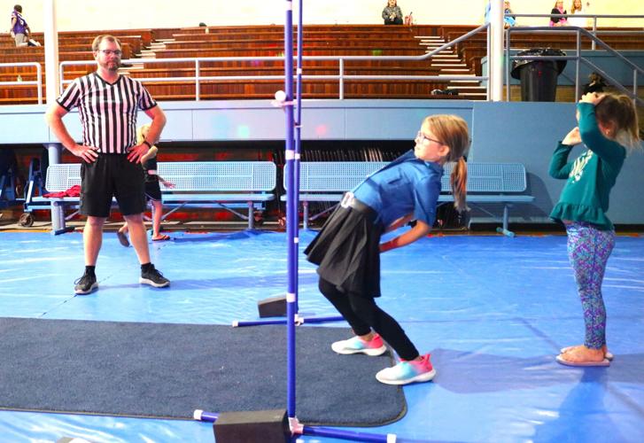 Mila Abels, 7, was dressed as a law enforcement officer who participated in the limbo contest under the supervision of Brett Geelan..JPG