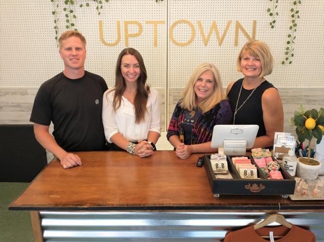 Ben and Anna Stene are pictured at left with prior Uptown Fitness owners Heather Yeoman and Rachel Olson, shown at right..jpg