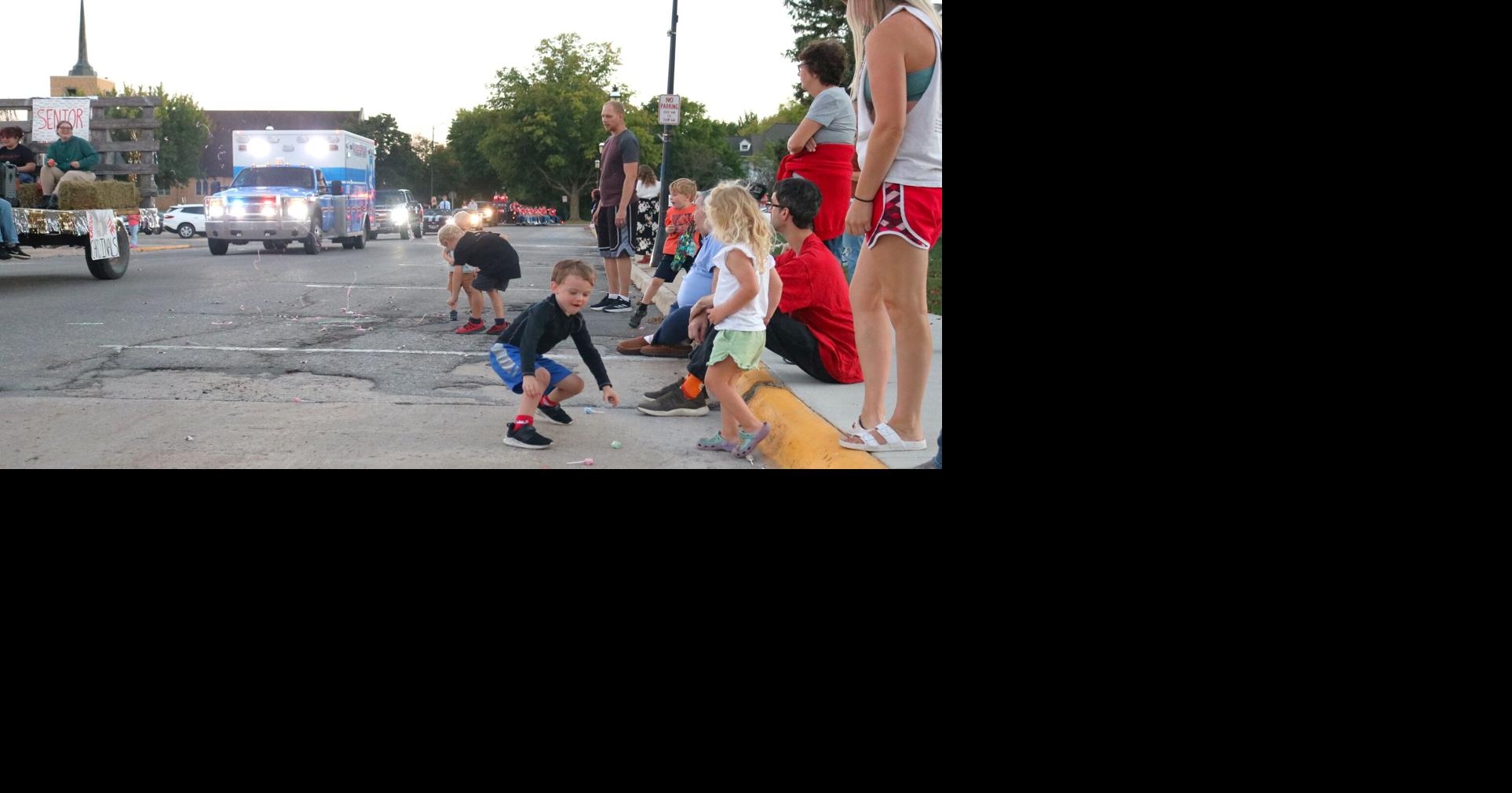 Kids raced for candy during the parade on Thursday in Forest