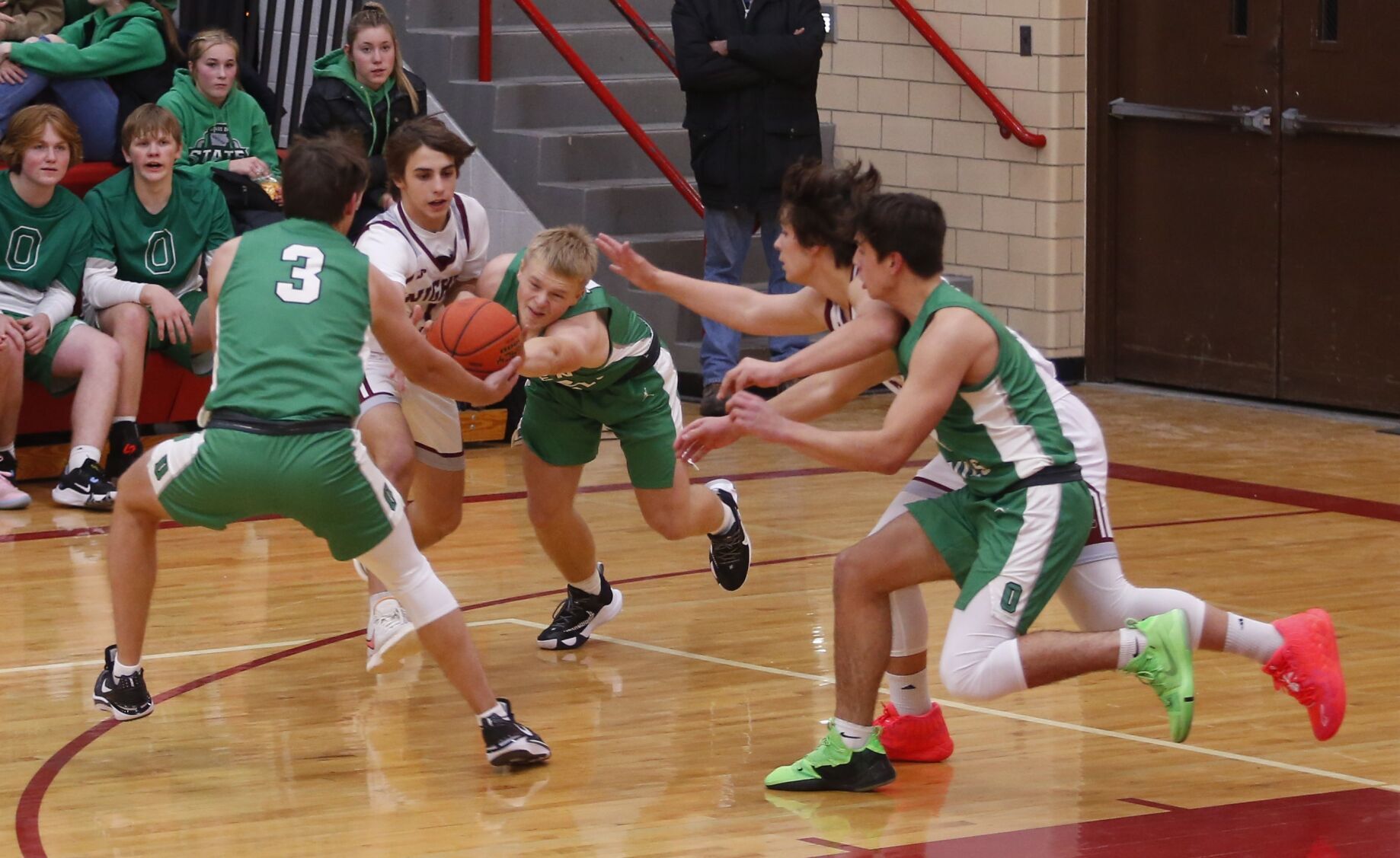 Osage Green Devils Dominate with 71-54 Win Over Newman Catholic: Strong Defensive Performance and Offensive Trio Shine