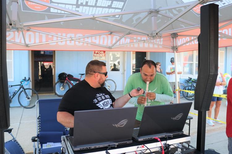 Jared Wingert of Mojo Productions DJ service holds the mic for James Williams.JPG