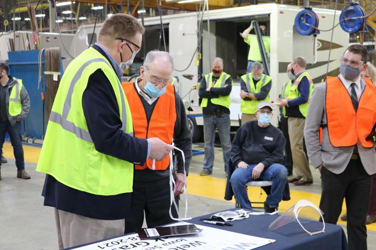 Chad Reece shows Senator Grassley Forms of PPE