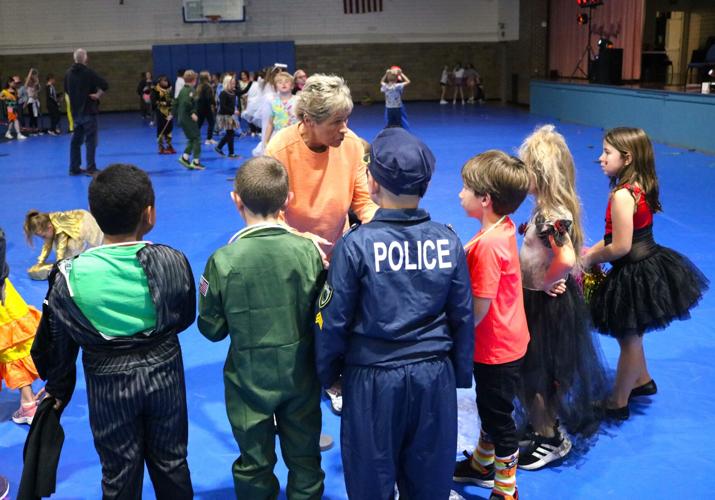 Sue Edmondson prepares participants for a game of Find the Puck at the Parks and Rec Elementary Halloween Party..JPG