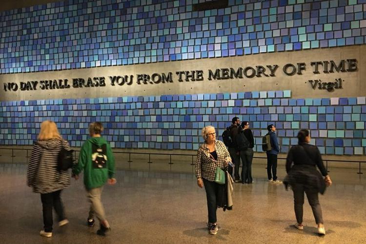 NEW YORK CITY, N.Y., 04/26/2019: 9/11 MEMORIAL: The inscription, "No day shall erase you from the memory of time," from the Roman poet Virgil, is displayed at the entrance to the National September 11 Memorial Museum in New York City. The quote, from Th...