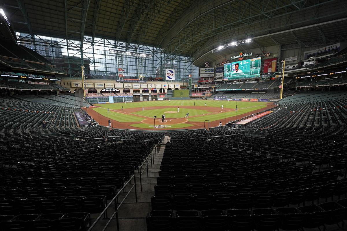 Empty stands, masked players as baseball returns