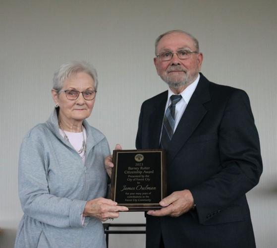 Mayor Ron Holland presented the 2023 Barney Ruiter Citizenship Award to Jim Oulman, whose wife accepted it in his absence. .JPG