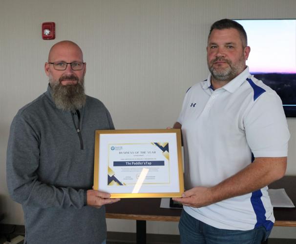 Co-owner Jay Steffensen of Paddler's Tap (left) accepted the 2023 Business of the Year Award at the Oct. 11 Forest City Community Partnership Awards..JPG