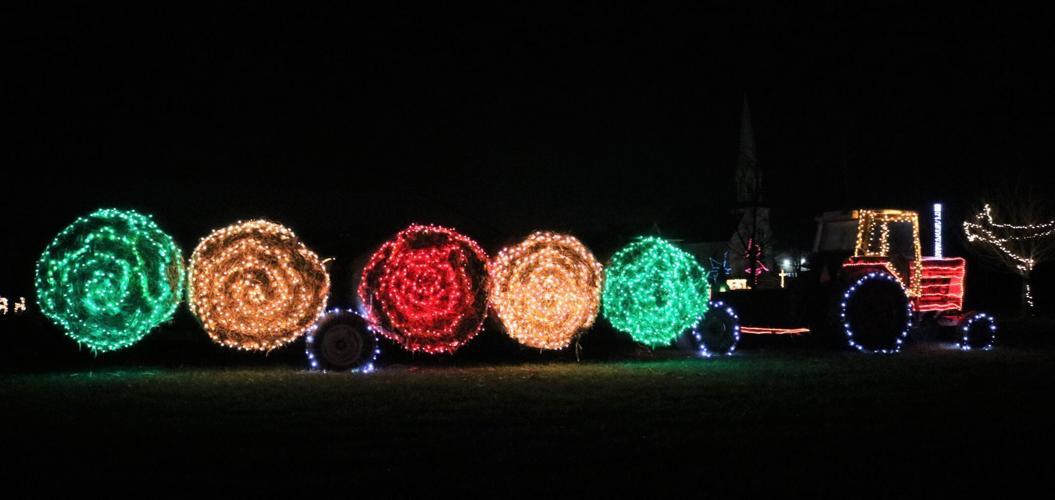 There just has to be a farm scene in an Iowa holiday lights display. Heritage Park has a tractor with round hay bales. (2).JPG