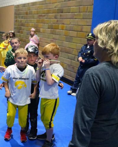 Young Iowa Hawkeye football players were among the costumes seen at the Civic Auditorium during the Parks and Rec Elementary Halloween Party..JPG