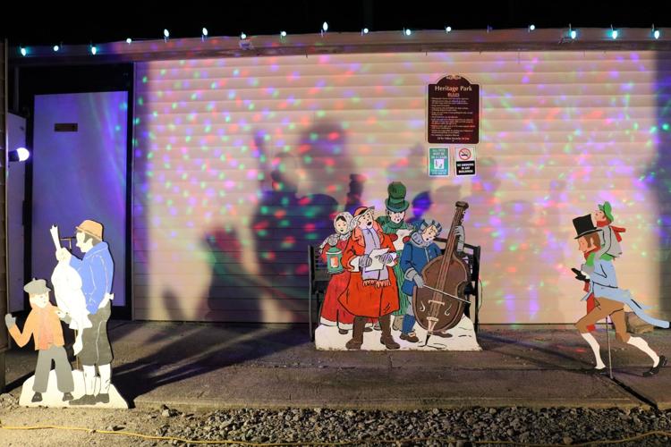 Even the Heritage Park restrooms are lit with Charles Dickens' A Christmas Carol cutouts..JPG