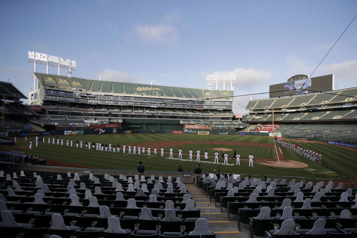 Empty stands, masked players as baseball returns