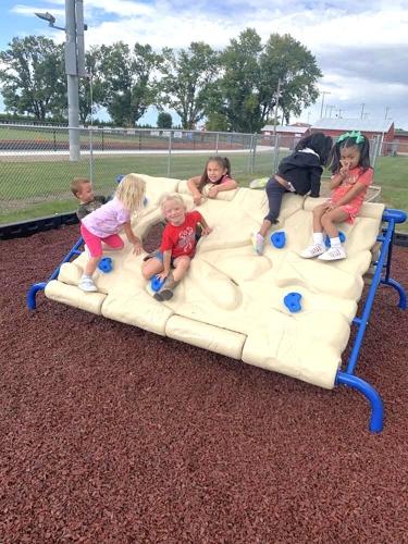 West Hancock Elementary School students are shown having fun on new playground equipment..jpg