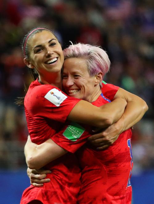 Alex Morgan of the USA celebrates with teammate Megan Rapinoe after scoring her team's twelfth goal during the 2019 FIFA Women's World Cup France group F match between USA and Thailand at Stade Auguste Delaune on June 11, 2019 in Reims, France.