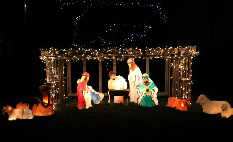 A nativity scene is displayed outside the Beaver Creek Church at Heritage Park in Forest City..JPG