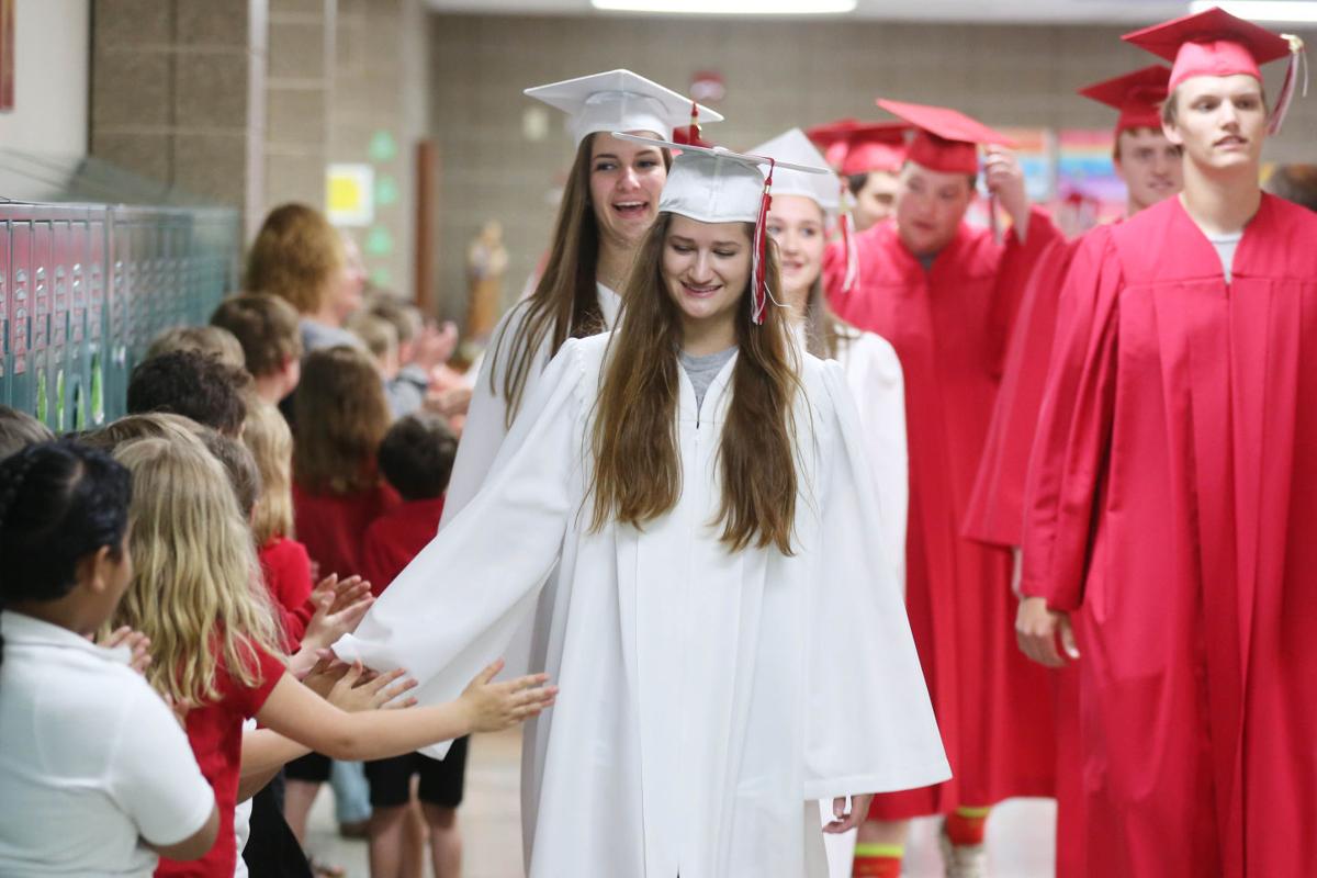 Newman seniors parade for graduation