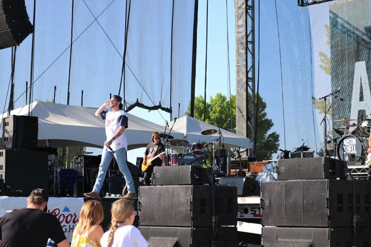 Austin Snell exhorts the DenimFest crowd.JPG