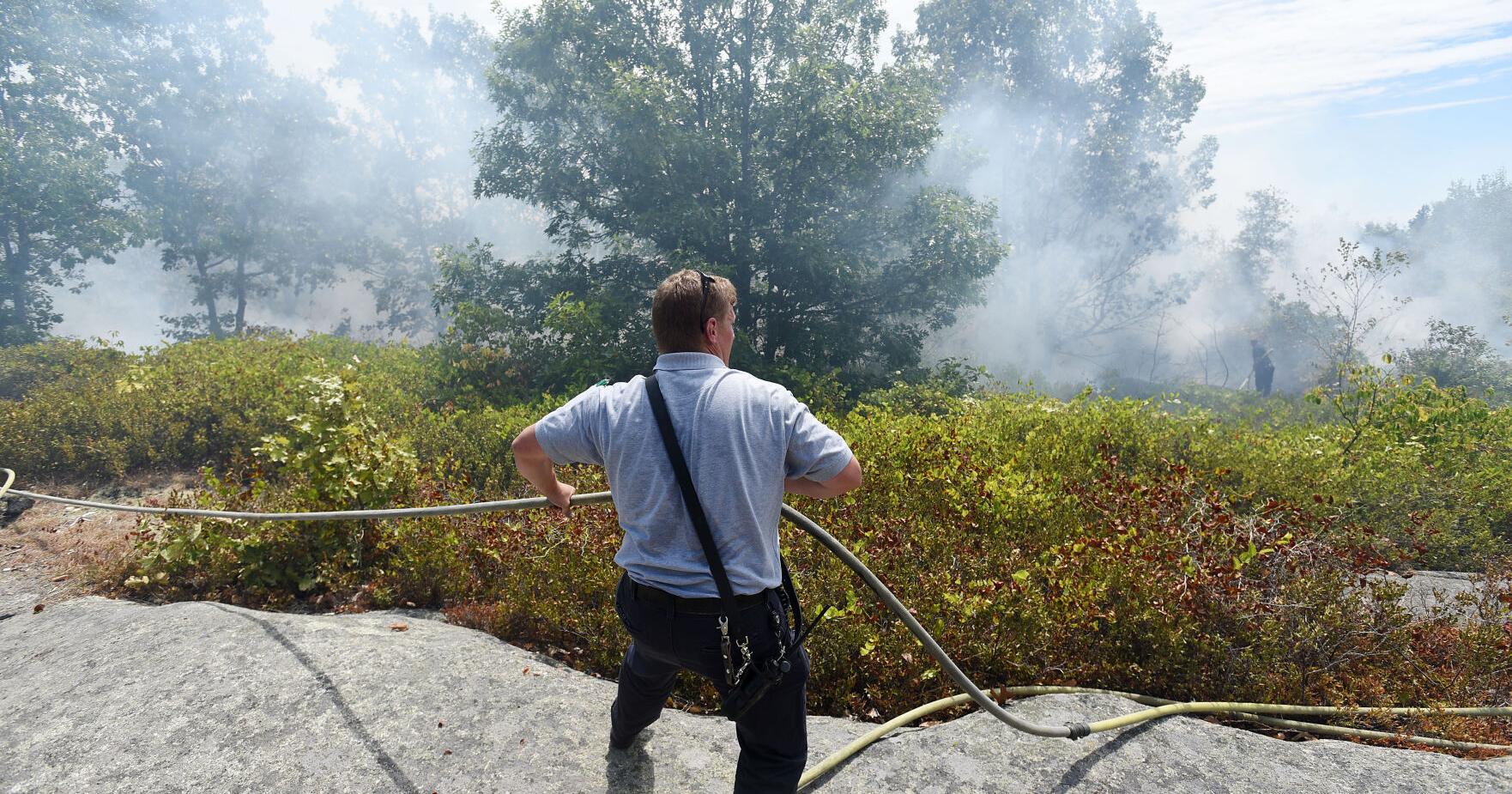 Crews monitor for brush fire flare-ups