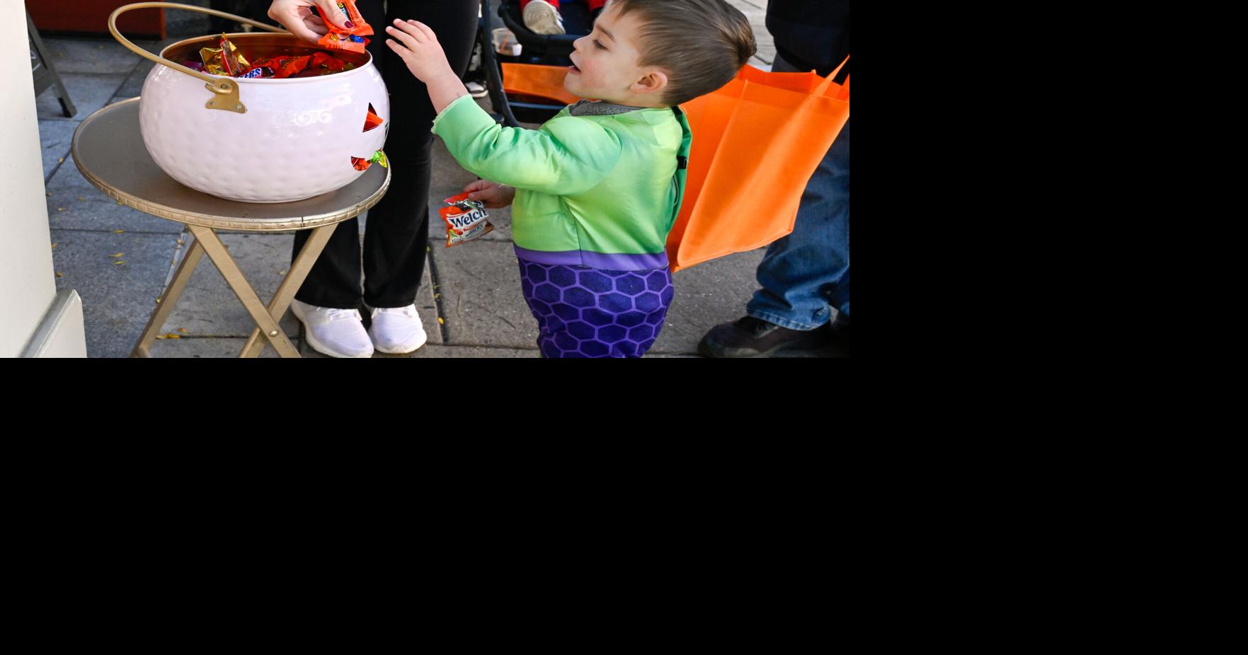 Todllers trick-or-treat downtown