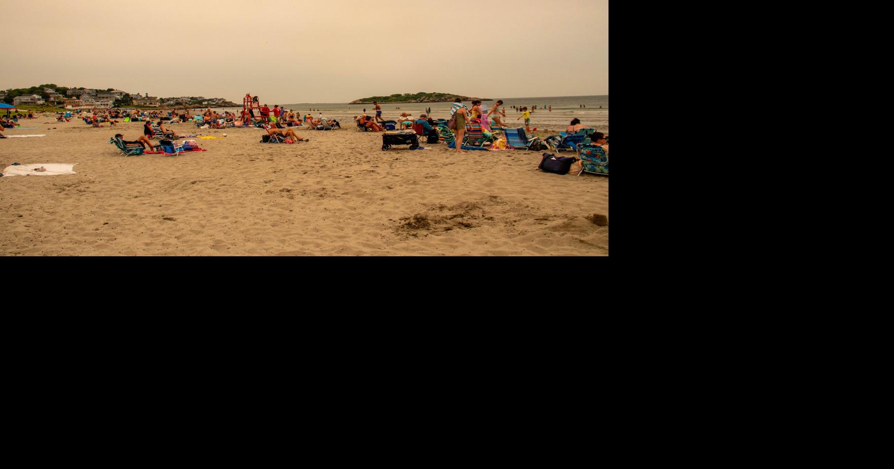 Beach-goers unbothered as wildfire smoke blankets Northeast