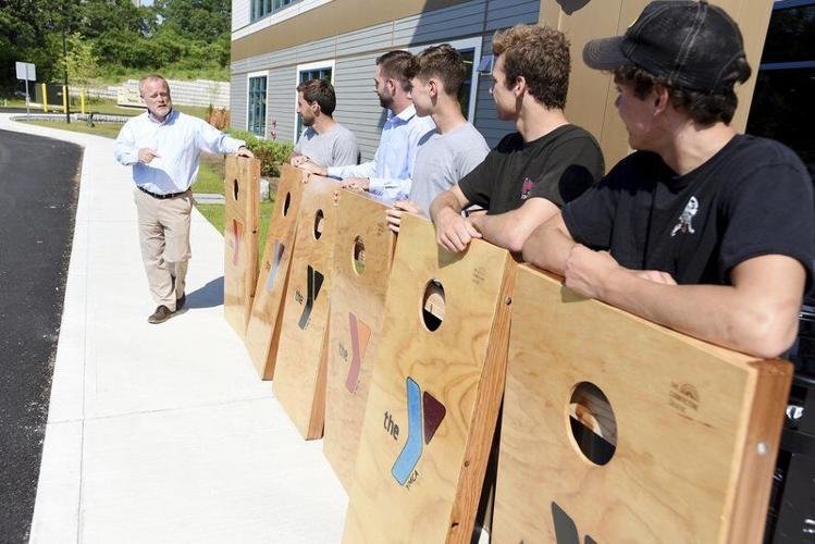 Teens build cornhole sets for YMCA, Local News