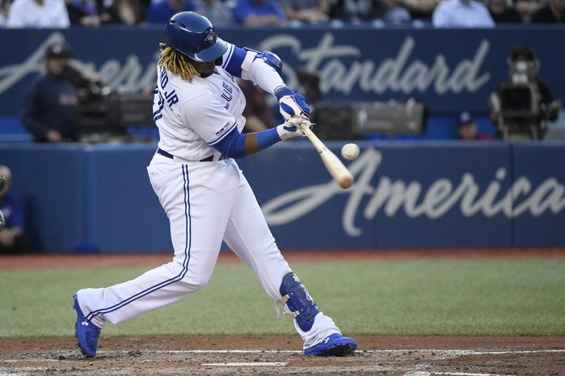 Vlad Guerrero Jr. talks with David Ortiz in Boston