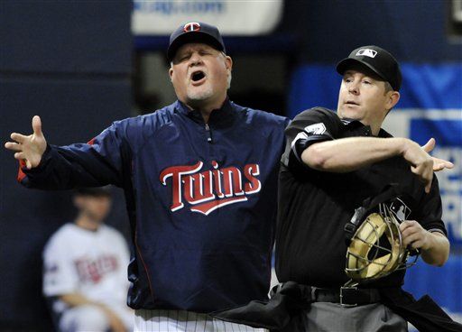 Minnesota Twins' Joe Crede stands on the field after flying out to