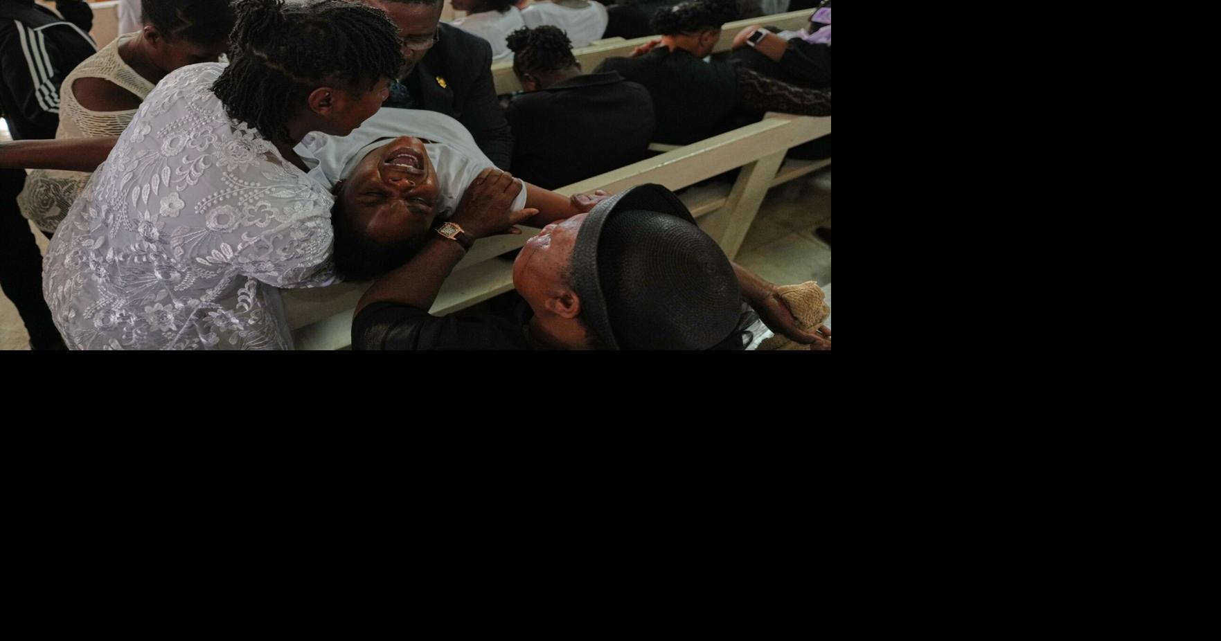 Mourners file into a church in Haiti where gangs killed dozens of people in latest rampage | National News