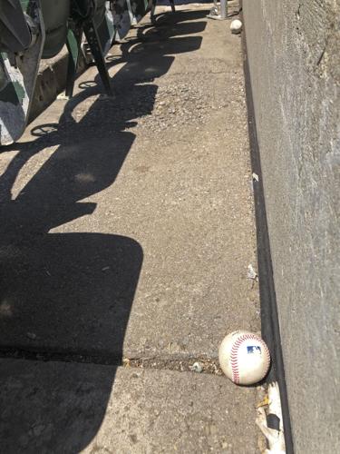 An Oakland A's fan caught foul balls on two consecutive pitches