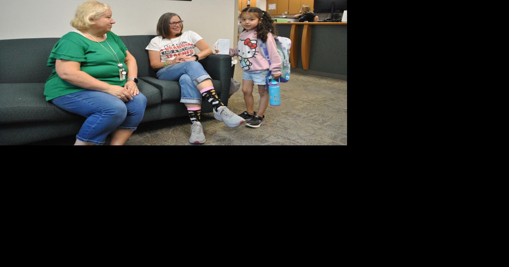 LAST BELL: Model's Bontrager & Miller wave goodbye on last day of school