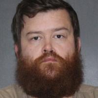 Man accused in murder of family members assaulter has first day in court